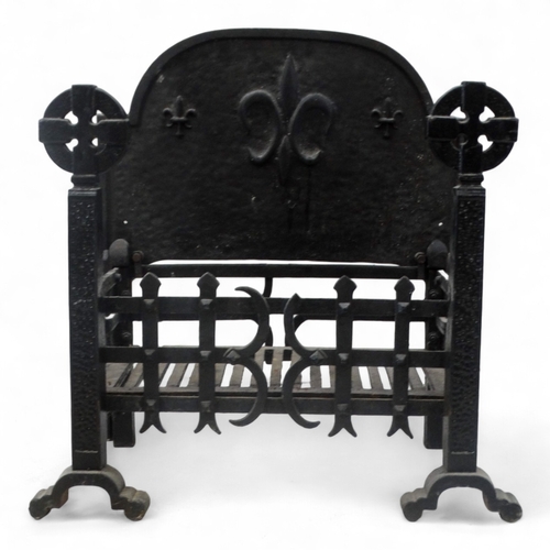 25 - A rectangular fire grate - with an openwork basket and a cast iron fire back decorated with a fleur ... 