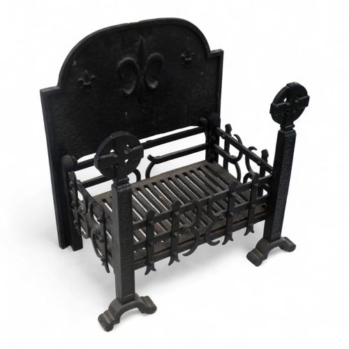 25 - A rectangular fire grate - with an openwork basket and a cast iron fire back decorated with a fleur ... 