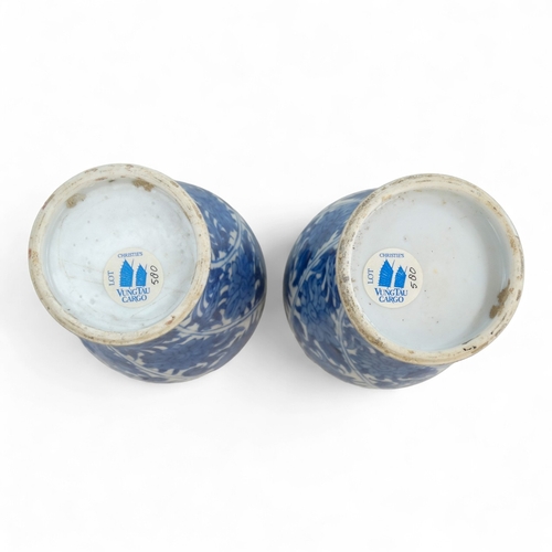 268 - A pair of late 17th century Chinese blue and white baluster vases with covers - painted with lotus s... 