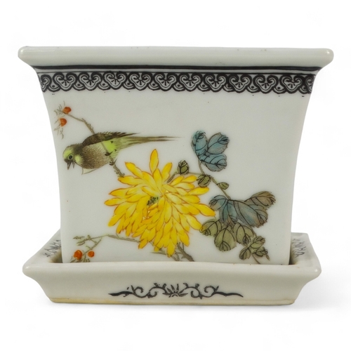 274 - A 20th century Chinese jardiniere - of tapered rectangular form decorated with birds and flowers, ra... 