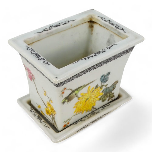 274 - A 20th century Chinese jardiniere - of tapered rectangular form decorated with birds and flowers, ra... 