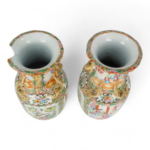 276 - A pair of 19th century Cantonese vases - of baluster form with famille verte decoration showing figu... 