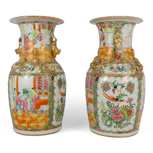 277 - A pair of 19th century Cantonese vases - of baluster form with famille verte decoration showing figu... 