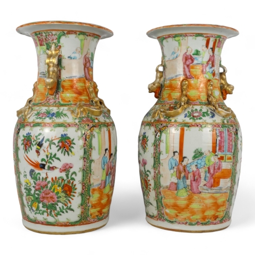 277 - A pair of 19th century Cantonese vases - of baluster form with famille verte decoration showing figu... 