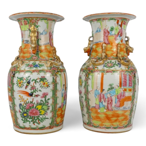 277 - A pair of 19th century Cantonese vases - of baluster form with famille verte decoration showing figu... 