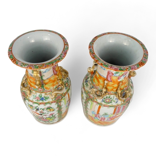 277 - A pair of 19th century Cantonese vases - of baluster form with famille verte decoration showing figu... 