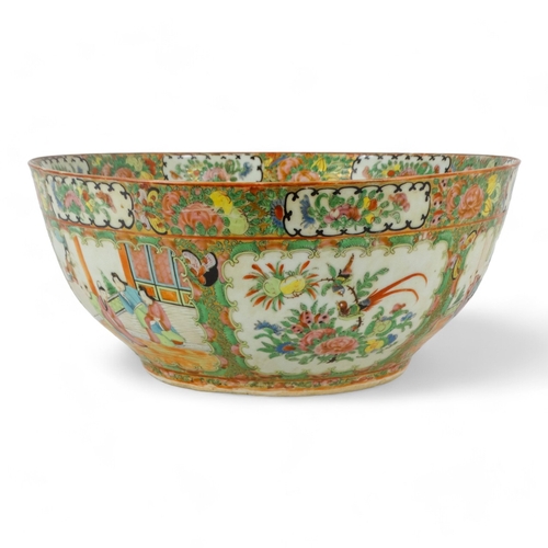 280 - A late 19th century Cantonese famille verte punch bowl - of large proportions and decorated in typic... 