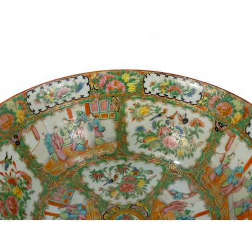 280 - A late 19th century Cantonese famille verte punch bowl - of large proportions and decorated in typic... 