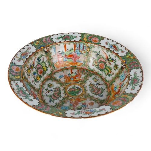 284 - A late 19th century Cantonese famille verte bowl - with a broad rim, the interior decorated with vig... 