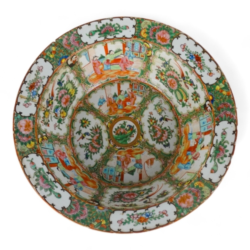 284 - A late 19th century Cantonese famille verte bowl - with a broad rim, the interior decorated with vig... 