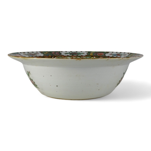 284 - A late 19th century Cantonese famille verte bowl - with a broad rim, the interior decorated with vig... 