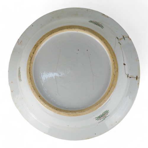 284 - A late 19th century Cantonese famille verte bowl - with a broad rim, the interior decorated with vig... 