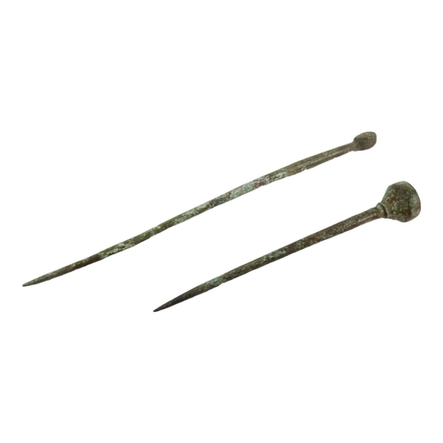 40 - A Romano-British bronze hair pin - 5cm long, together with another longer example. (2)