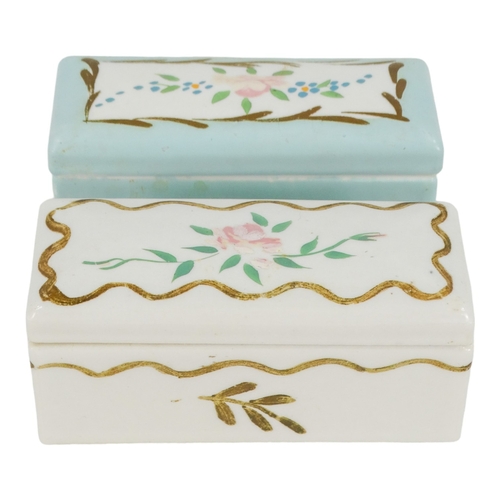 48 - A late 19th century Limoges stamp box - duck egg blue and decorated with flowers, 9cm wide, together... 