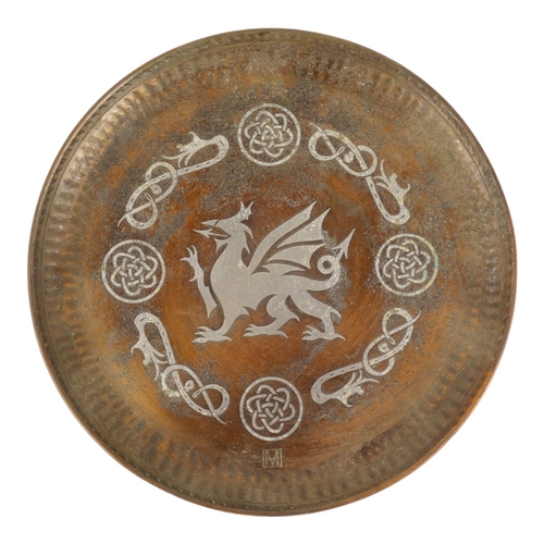 51 - Hugh Wallis (British, 1871-1943) a copper and pewter dish - decorated with a dragon, signed with ini... 