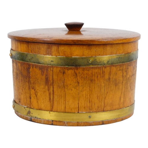 53 - A coopered teak biscuit barrel - the circular tub with brass bands, 25cm diameter.