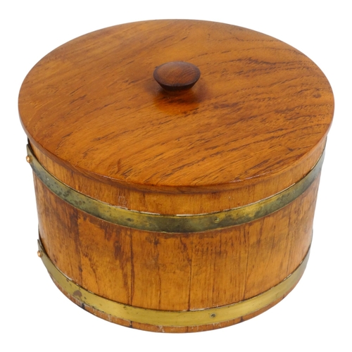 53 - A coopered teak biscuit barrel - the circular tub with brass bands, 25cm diameter.