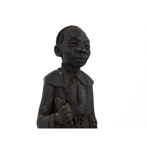 57 - A terracotta figure of an African priest - 41cm high.