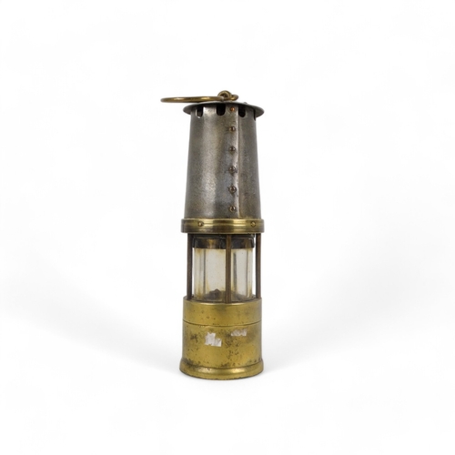 59 - An early 20th century miner's lamp - J H Naylor Ltd of Wigan, brass and steel, 27cm high.