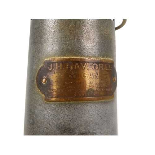 59 - An early 20th century miner's lamp - J H Naylor Ltd of Wigan, brass and steel, 27cm high.