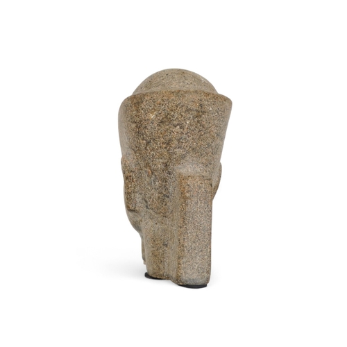 60 - A reconstituted stone figure of an Egyptian god - 23cm high.