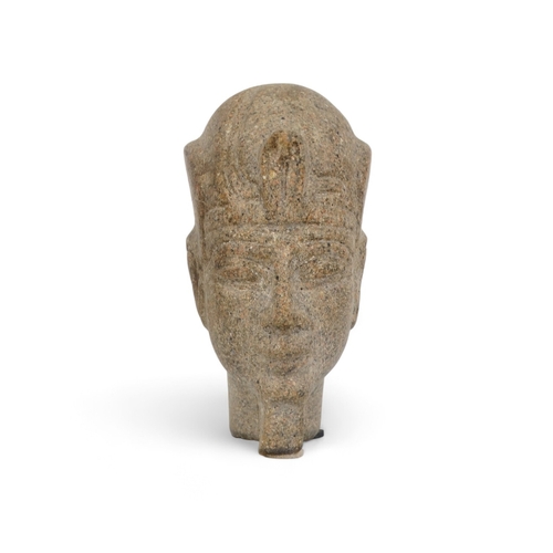 60 - A reconstituted stone figure of an Egyptian god - 23cm high.