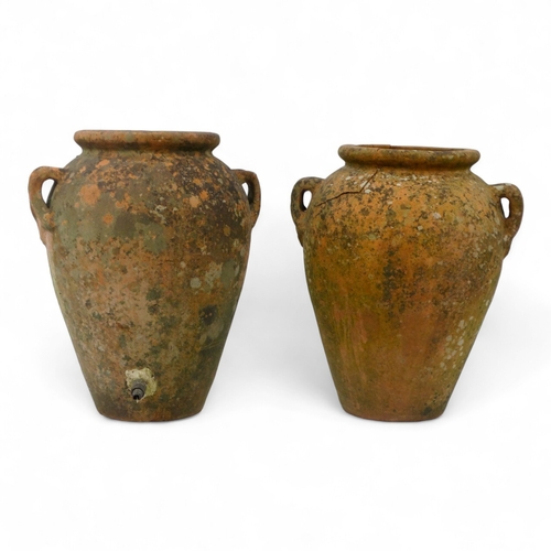 67 - A pair of twin handled terracotta olive jars - one with a tap, height 53cm, diameter 37cm.