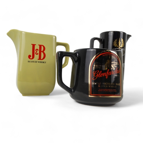 75 - A Wade J&B whisky water jug - the company branding on a sage green ground, 16cm high, together with ... 