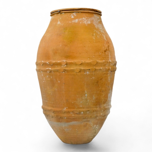 78 - A terracotta olive jar - with turned rim and two bands of abstract decoration, height 73cm, diameter... 