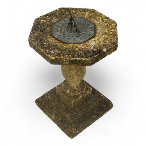 82 - A reconstituted stone sun dial - the octagonal bronze dial signed 'June Fries', overall height 58cm.