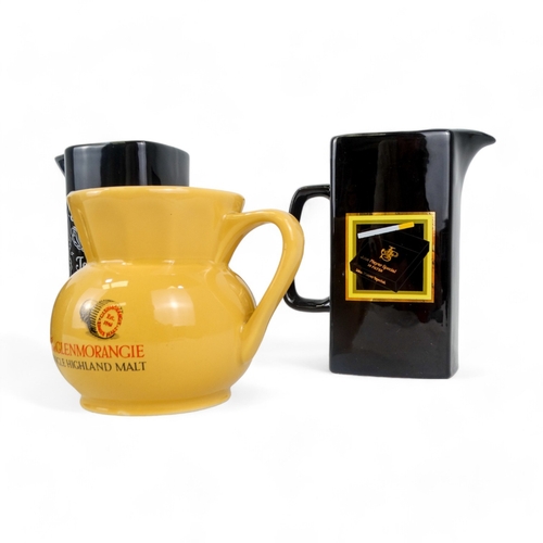 89 - A Tomatin branded water jug - black with company branding, 14cm high, together Glenfiddich, Jack Dan... 