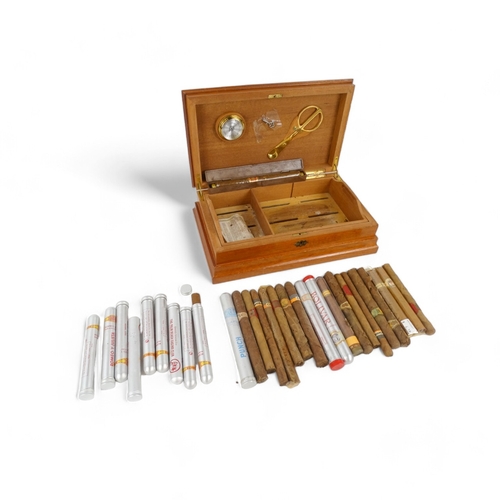 92 - A humidor of cigar box cedar - of rectangular form with hinged lid decorated by stringing, the inter... 