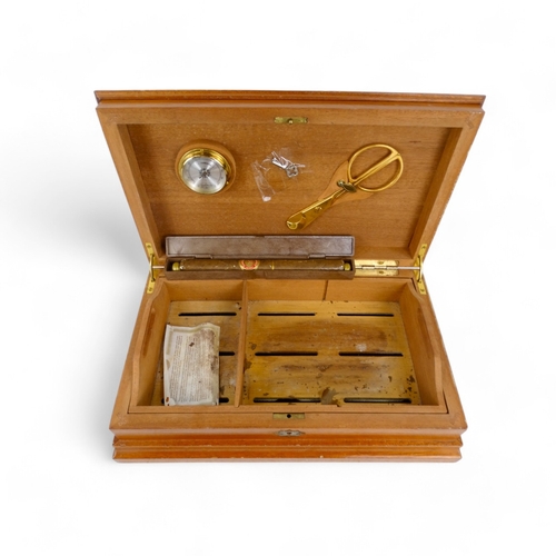 92 - A humidor of cigar box cedar - of rectangular form with hinged lid decorated by stringing, the inter... 