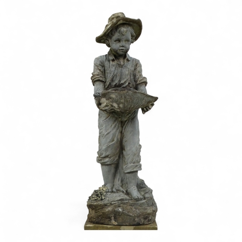 95 - A resin statue modelled as a boy holding a shell - on a reconstituted stone floral decorated plinth,... 