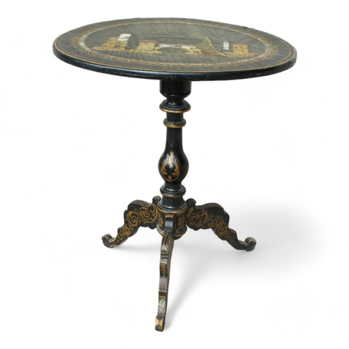 954 - A Victorian papier mache tilt top table - the circular top with lake scene within a mother-of-pearl ... 