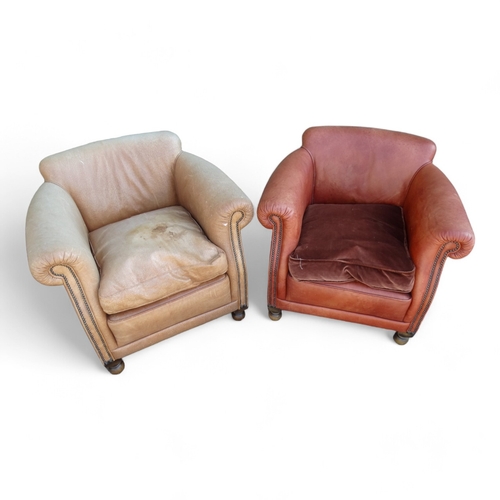 955 - A pair of brown leather club chairs - with decorative brass studwork.