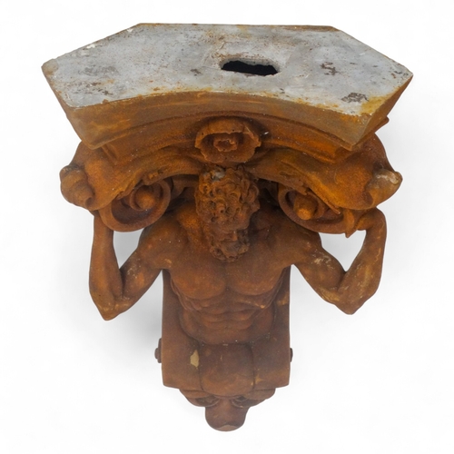 99 - A resin plaque modelled as Hercules - supporting a Corinthian column, height 55cm.