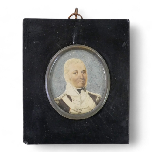 103 - An early 19th century portrait miniature - a gentleman in white shirt and black stock and coat, oval... 