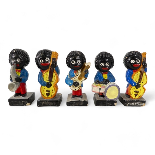 106 - A collection of ten Robertson's band members - plaster cast and polychrome painted.