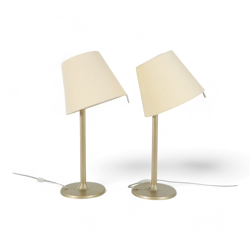 116 - A pair of table lamps Adrien Gardere (b. 1972) for Artemide - with tilting shades on bronzed bases, ... 