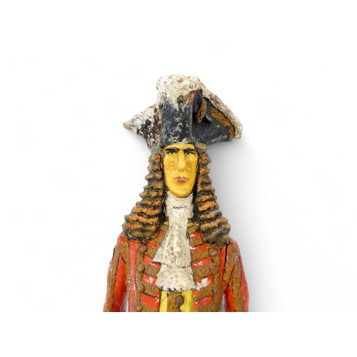 118 - A 20th century wood and papier mache figure of the Duke of Marlborough - standing on a square base, ... 