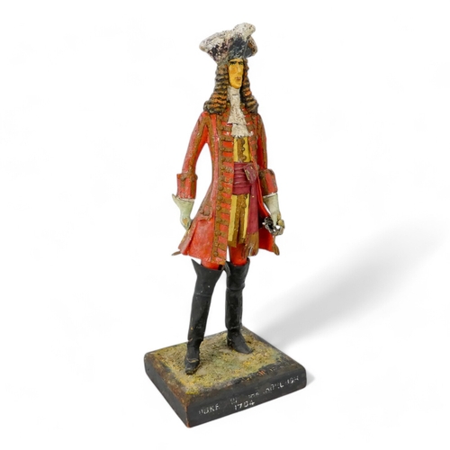 118 - A 20th century wood and papier mache figure of the Duke of Marlborough - standing on a square base, ... 