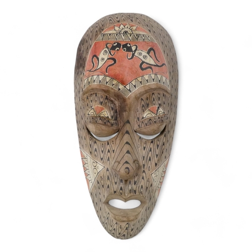 119 - A vintage African wall mask - natural polished wood with black details, 47cm high together with an p... 