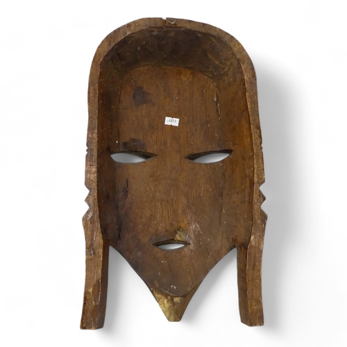 119 - A vintage African wall mask - natural polished wood with black details, 47cm high together with an p... 