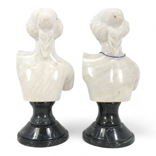 121 - A pair of 20th century carved white marble busts - Grecian style women, and raised on circular grey ... 