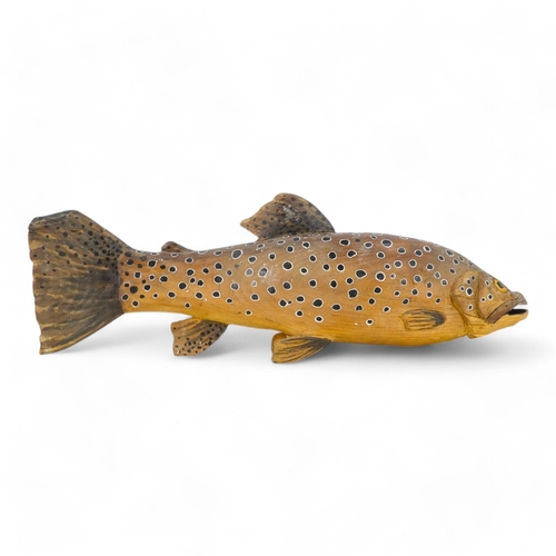 124 - A carved hardwood salmon-trout - painted finish, 41cm wide.