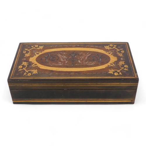 130 - An olive wood and inlaid box - rectangular with foliate inlaid hinged cover, 18cm wide.