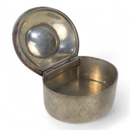 15 - A early 20th century pewter box by Liberty & Co - oval inset with mother-of-pearl, stamped to base.