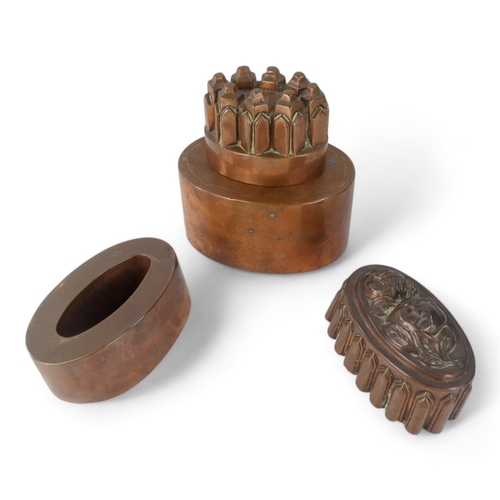 17 - A Victorian copper jelly mould - oval and modelled with fruit and ribbed lancet panels, 37cm wide, t... 