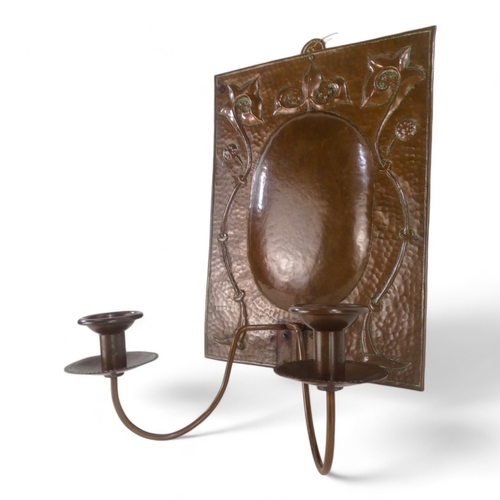 18 - A fine copper twin branch wall sconce by John Pearson - rectangular with foliate repousse decoration... 